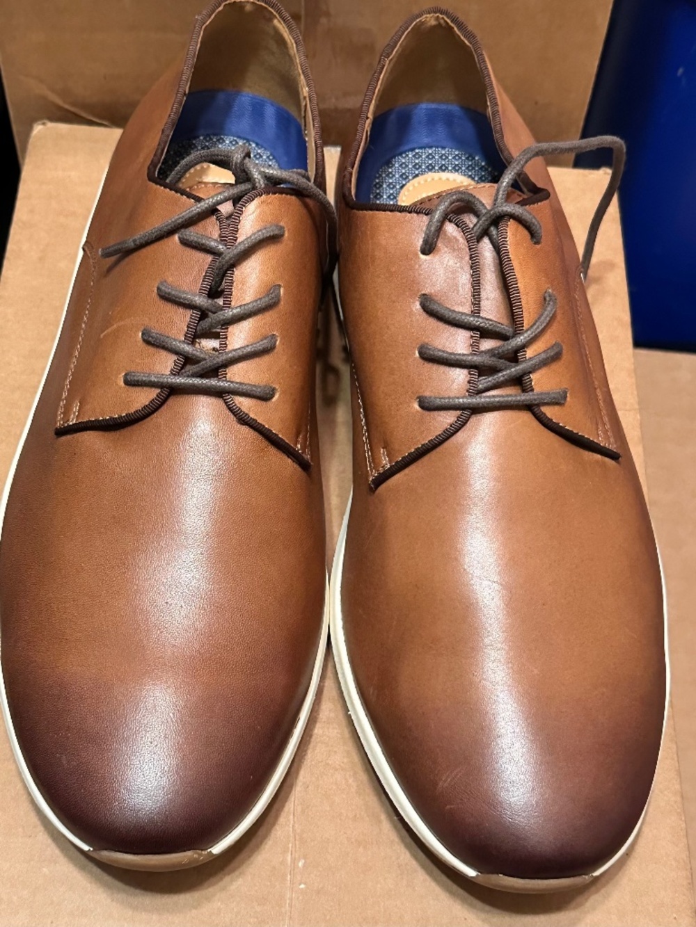 Vince Camuto men's brown leather oxfords featuring a distinctive blue geometric